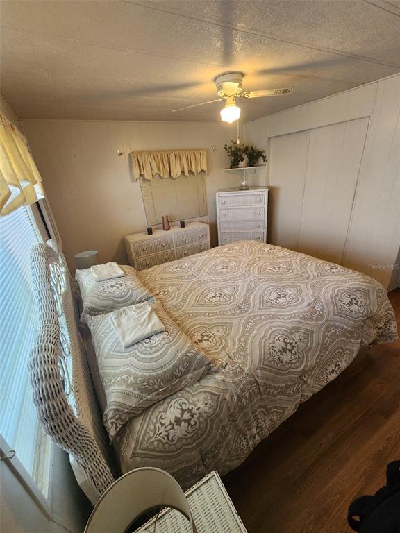 6400 Taylor/trout Road, Unit 96 Punta Gorda, FL 33950 - Photo 16 of 17 a bedroom with a bed and a mirror