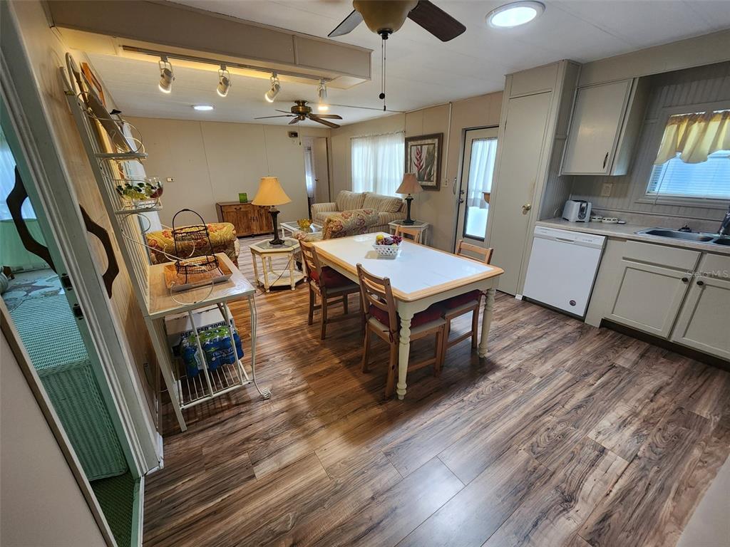 6400 Taylor/trout Road, Unit 96 Punta Gorda, FL 33950 - Photo 8 of 17 a room with wooden floors and white walls