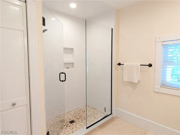 a bathroom with a sink mirror vanity and toilet