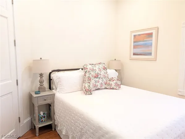 a bed room with a bed chair and a window