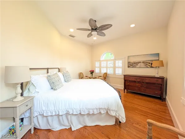 a bedroom with a bed and a table