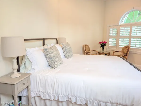 a kitchen with kitchen island granite countertop a sink window and cabinets