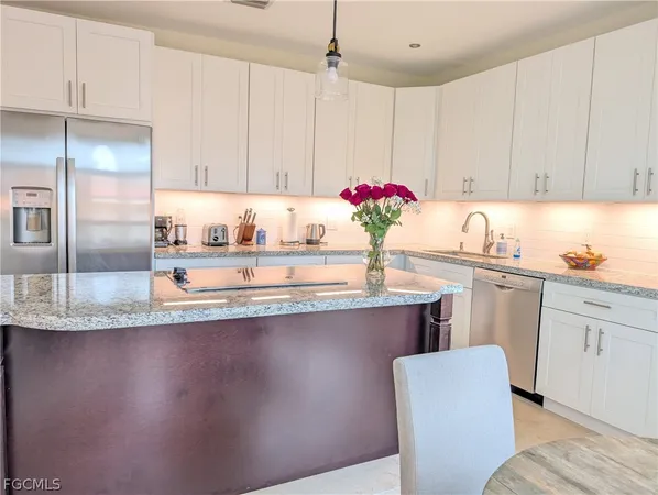 a view of a bedroom with wooden floor and a bed