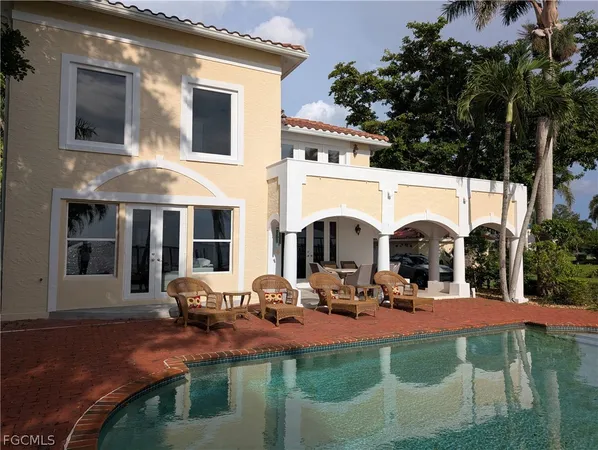 a view of swimming pool with outdoor seating