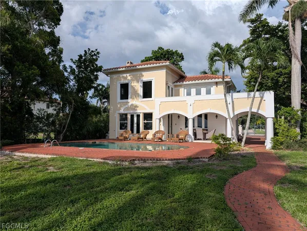 an outdoor view of house with outdoor space garden and patio