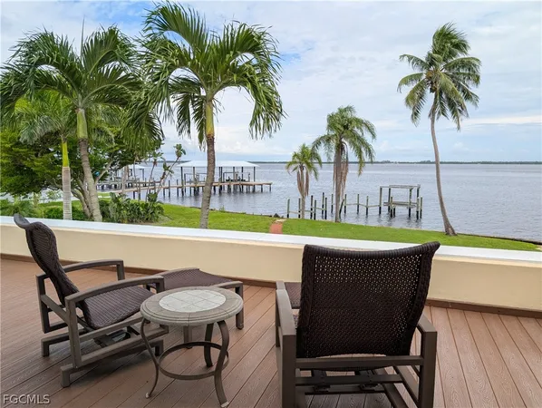 a view of a swimming pool with chair and table