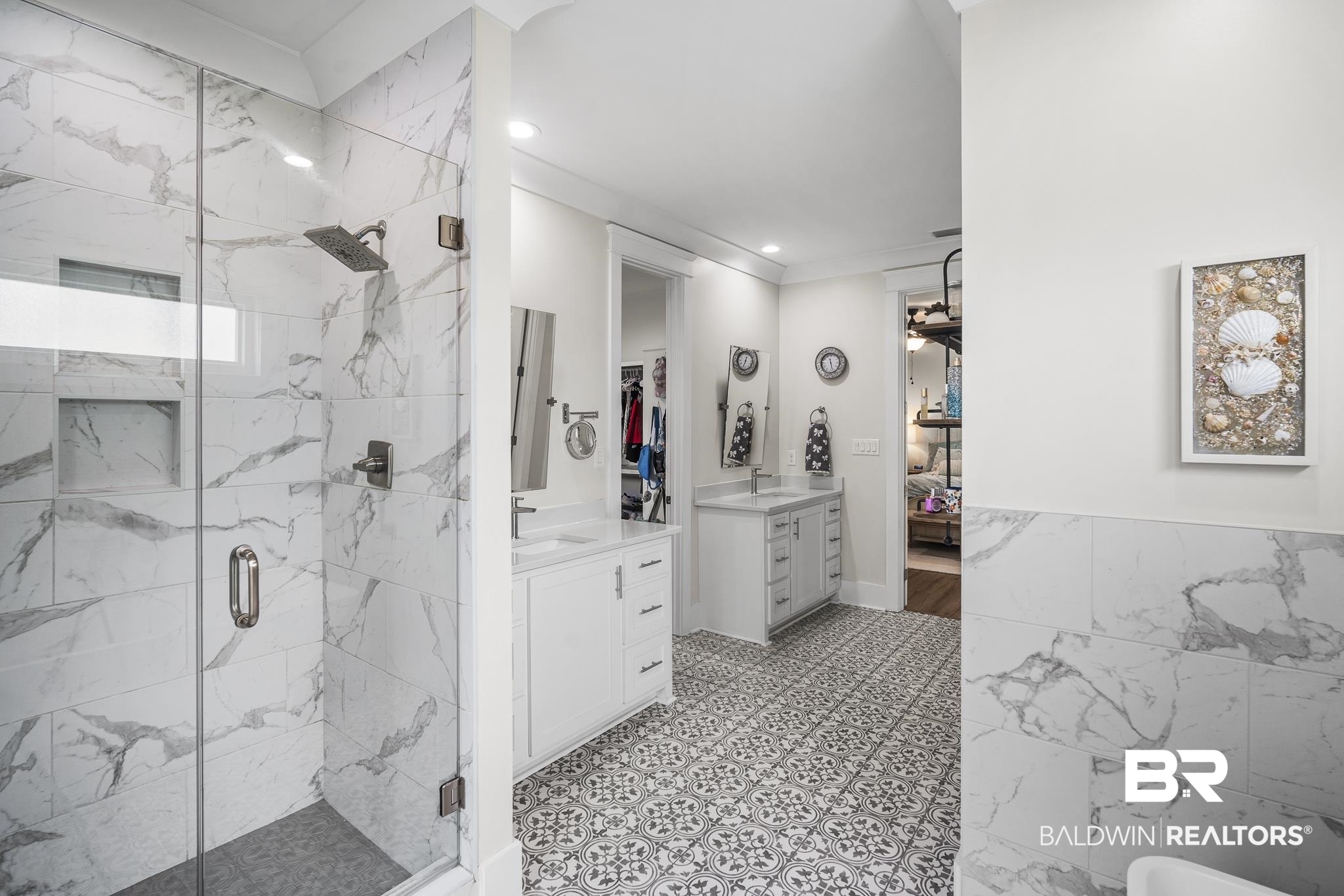 21702 Pillars Street Fairhope, AL 36532 - Photo 26 of 54 Glass-enclosed shower with marble-finish tile surround and built-in niche