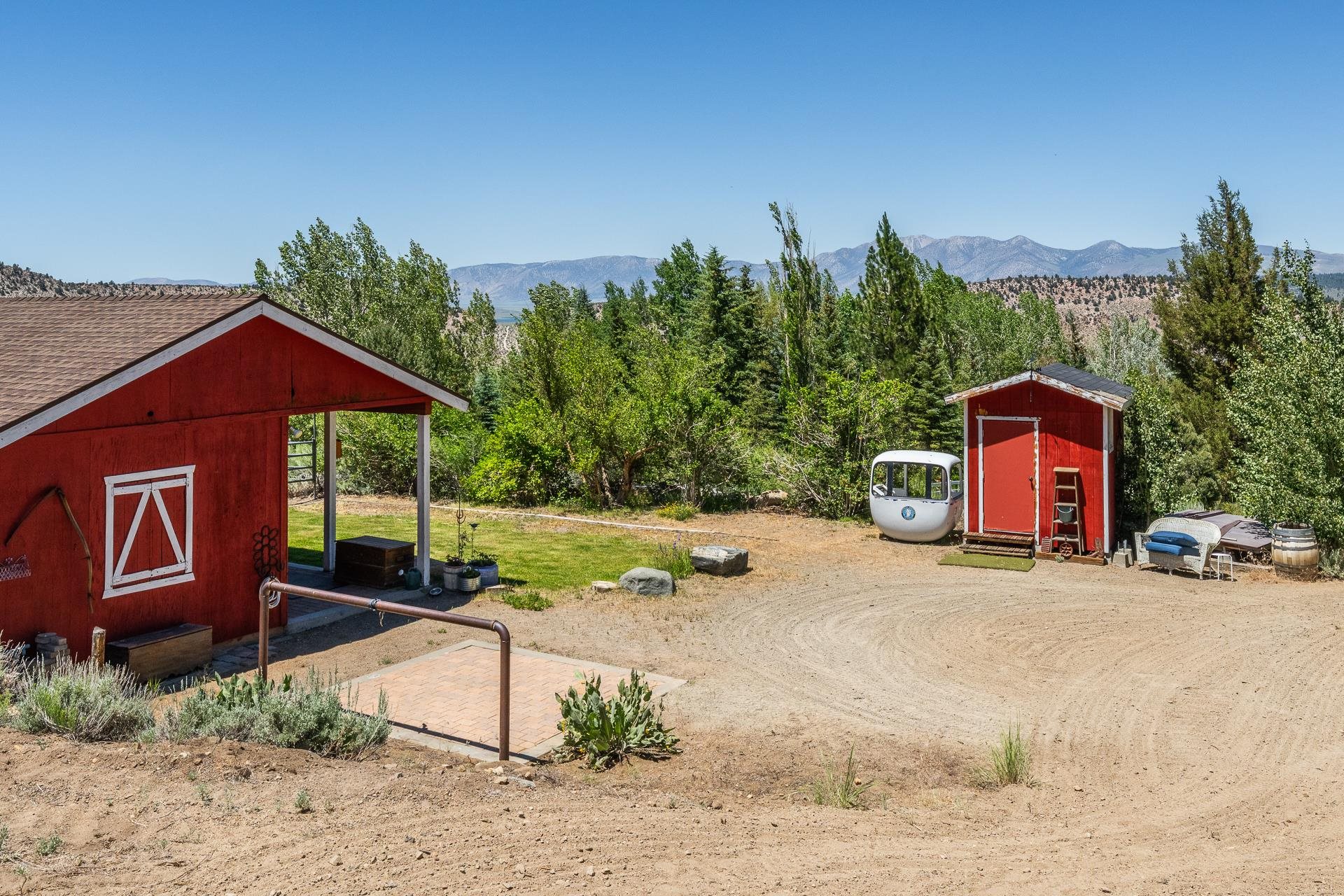 537 Aspen Spring Ranch Road Mammoth Lakes, CA 93546 - Photo 31 of 40 Red siding structure with a covered porch and white trim window detail