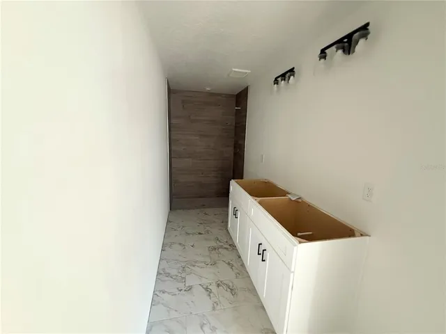 a utility room with cabinets