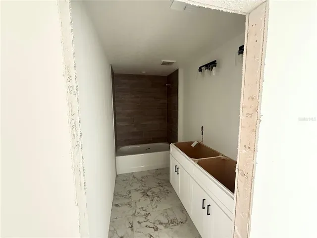 a view of a hallway with workspace