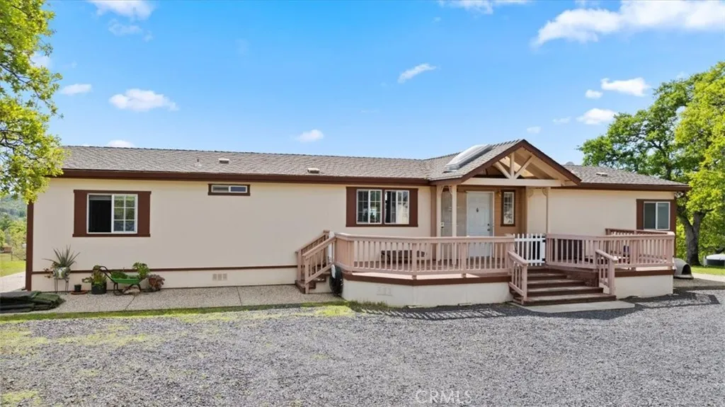 a view of a house with wooden fence