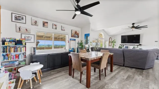 a kitchen with stainless steel appliances kitchen island granite countertop a refrigerator and a stove top oven