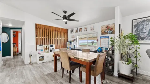 a kitchen with white cabinets and sink