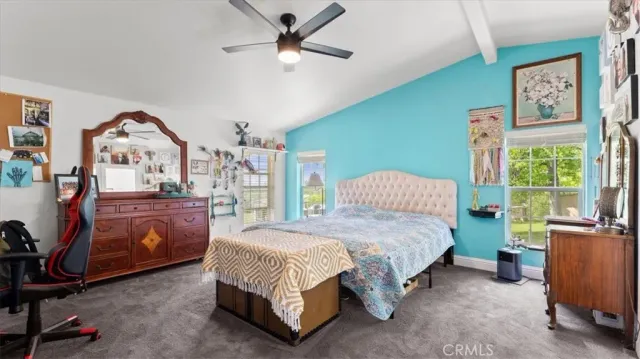 a bathroom with a granite countertop sink a large mirror and a bathtub