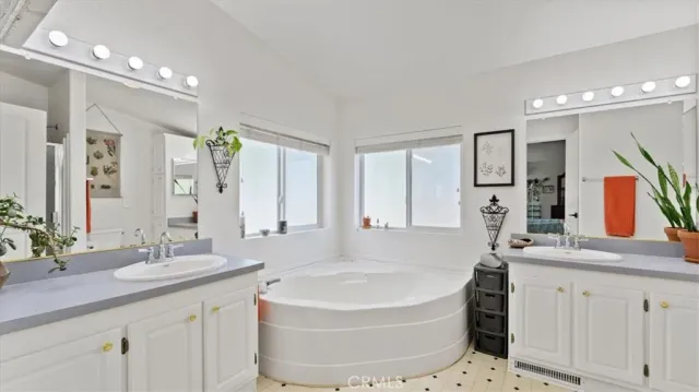 a bedroom with a bed a desk and chair with the outer view