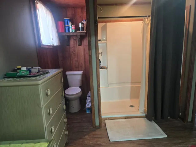a view of a house with a chairs and table in a patio