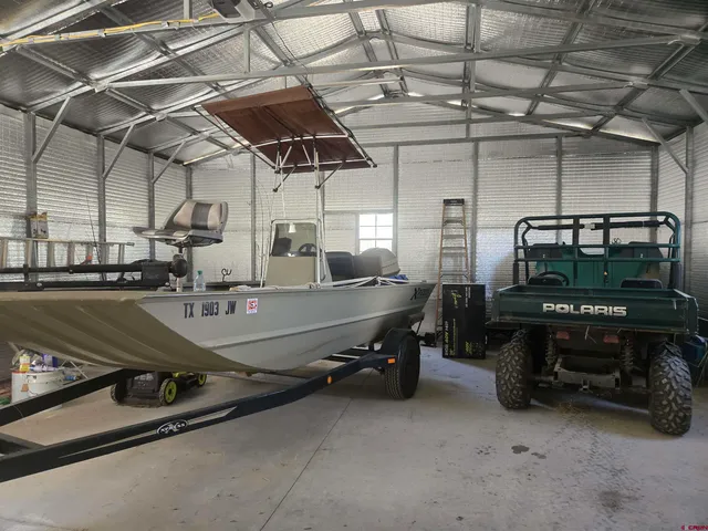 a view of a backyard with large trees