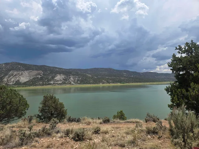 a view of a lake with mountains in the background