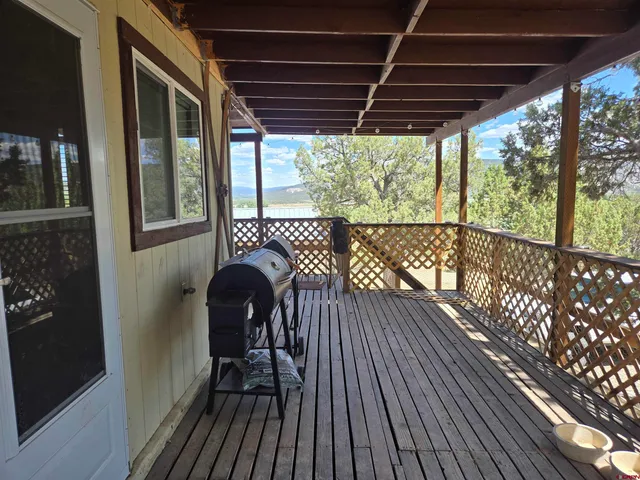 a view of balcony with wooden floor
