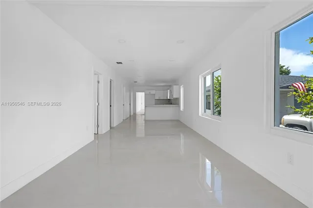 a view of an empty room and window