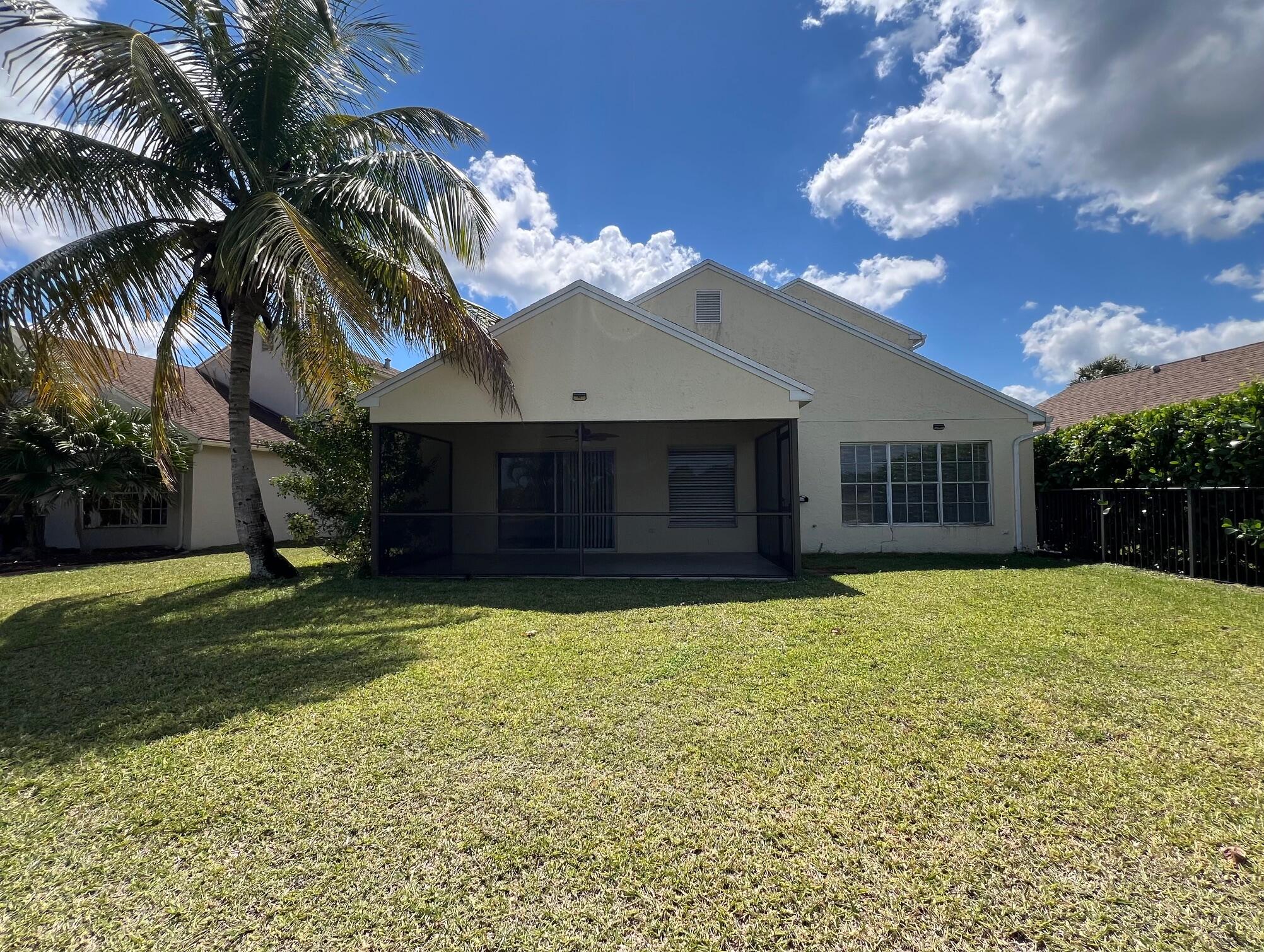 22492 Middletown Drive Boca Raton, FL 33428 - Photo 2 of 35 a front view of a house with a garden