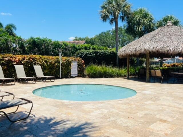 22492 Middletown Drive Boca Raton, FL 33428 - Photo 25 of 35 a view of a swimming pool with a patio and a yard