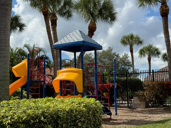an outdoor space with furniture and palm tree