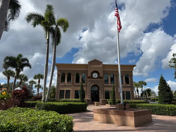 a front view of a building with garden