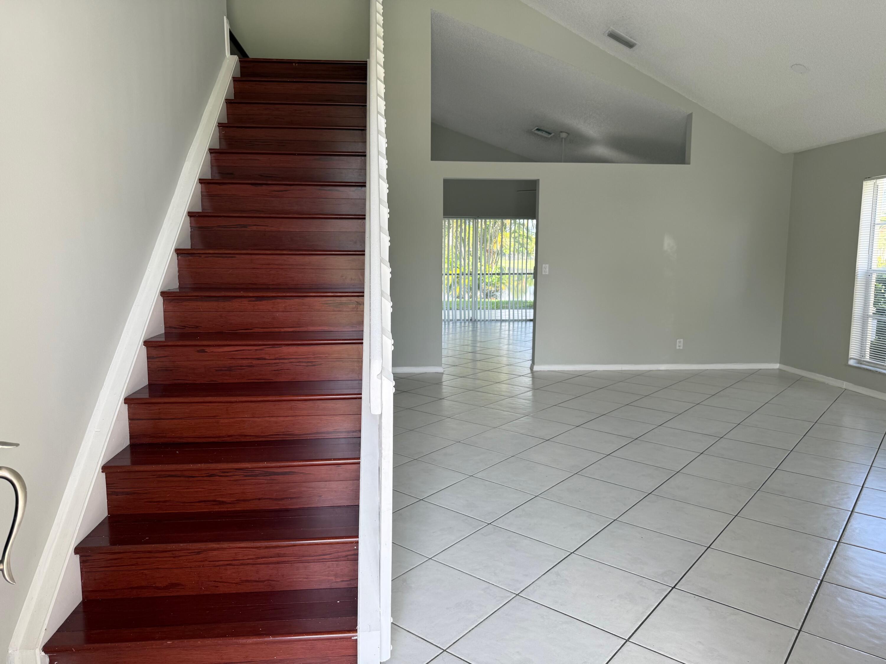 22492 Middletown Drive Boca Raton, FL 33428 - Photo 4 of 35 a view of entryway and hall with wooden floor