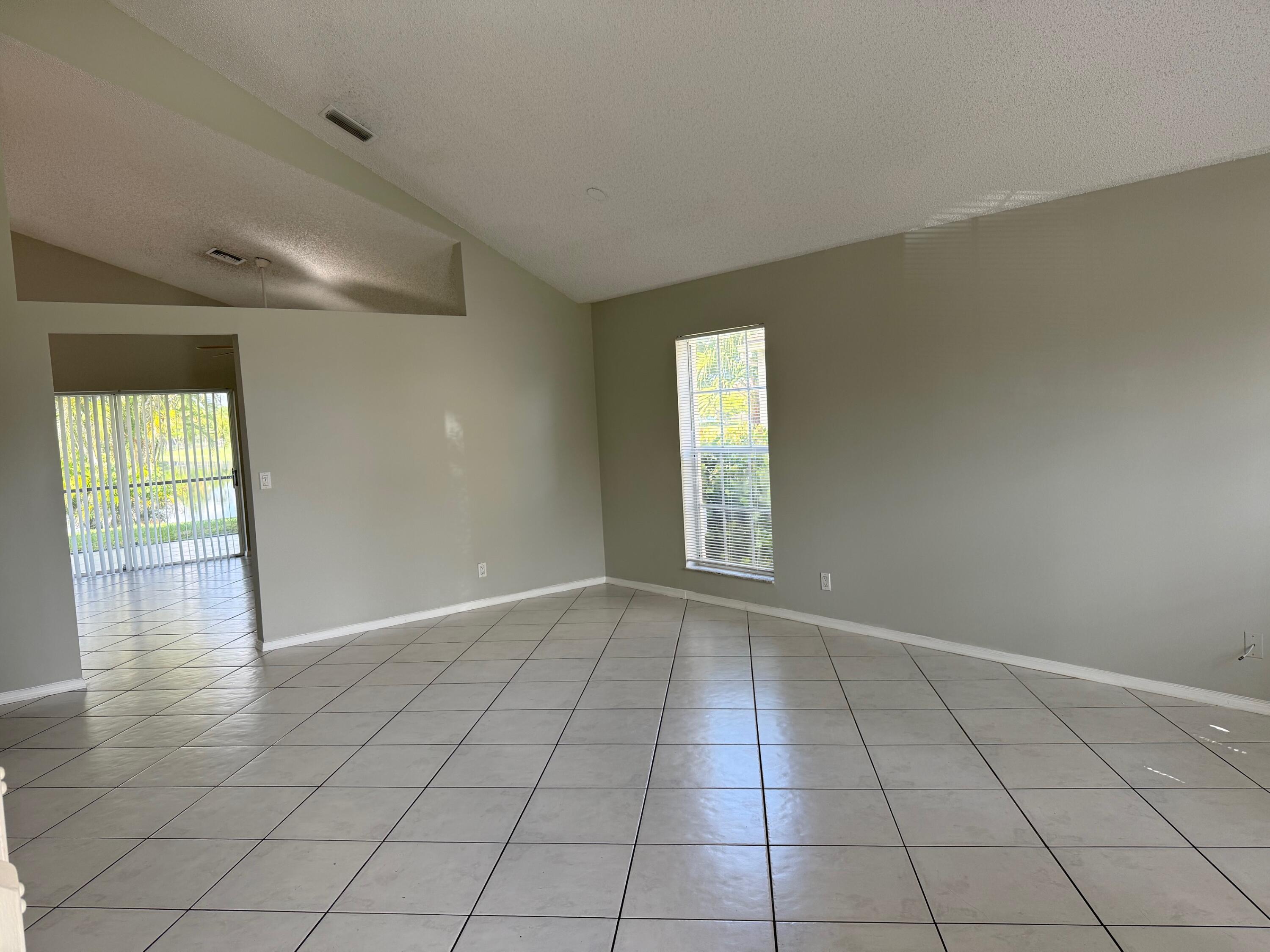 22492 Middletown Drive Boca Raton, FL 33428 - Photo 5 of 35 an empty room with windows