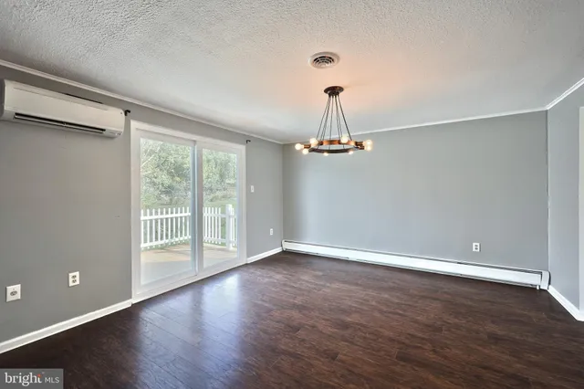 a large white kitchen with a large window