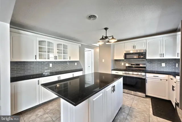 a bathroom with a bathtub sink and toilet