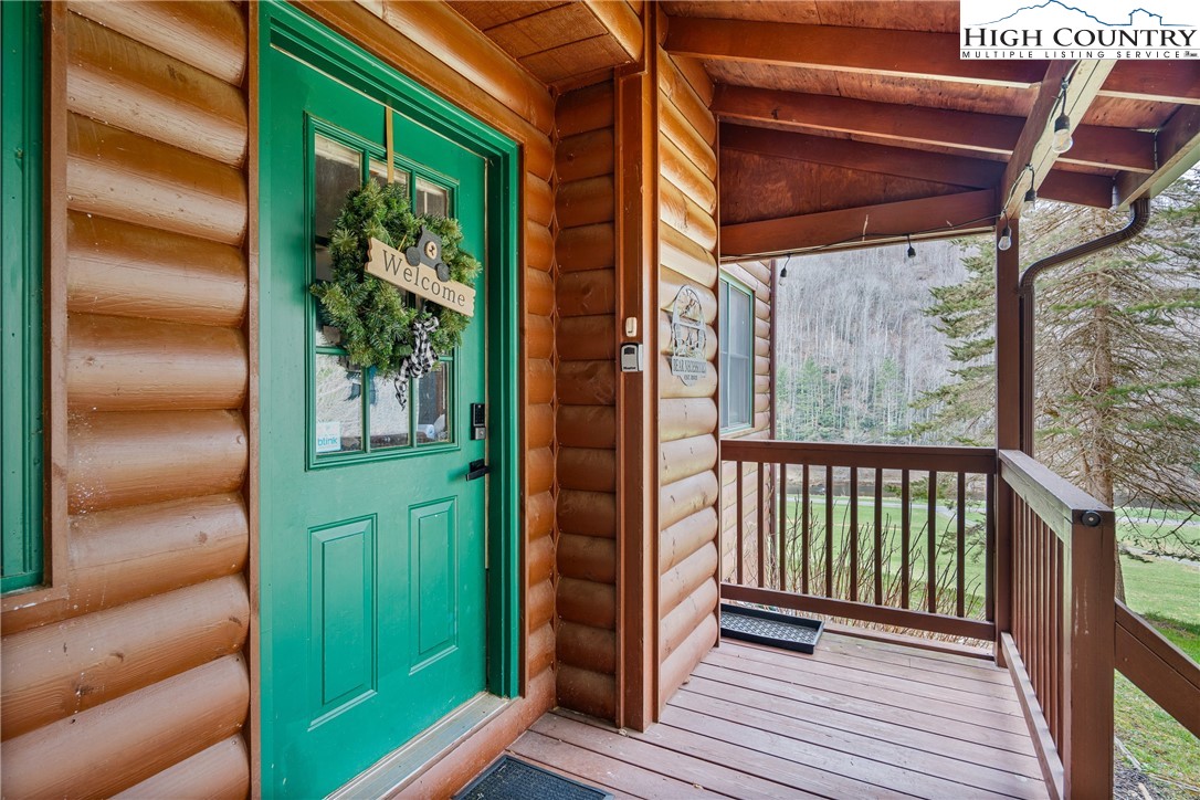 2408 Todd Railroad Grade Road Todd, NC 28684 - Photo 27 of 46 a view of a porch with furniture and a gate
