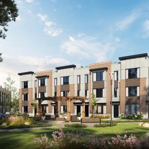 a front view of a residential apartment building with a yard