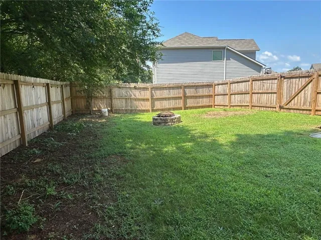 a view of backyard with green space