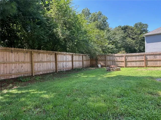 a view of backyard with green space