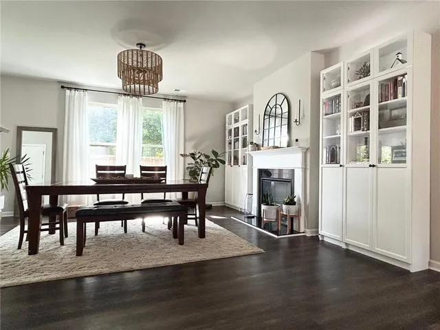 a view of a livingroom with furniture window and wooden floor