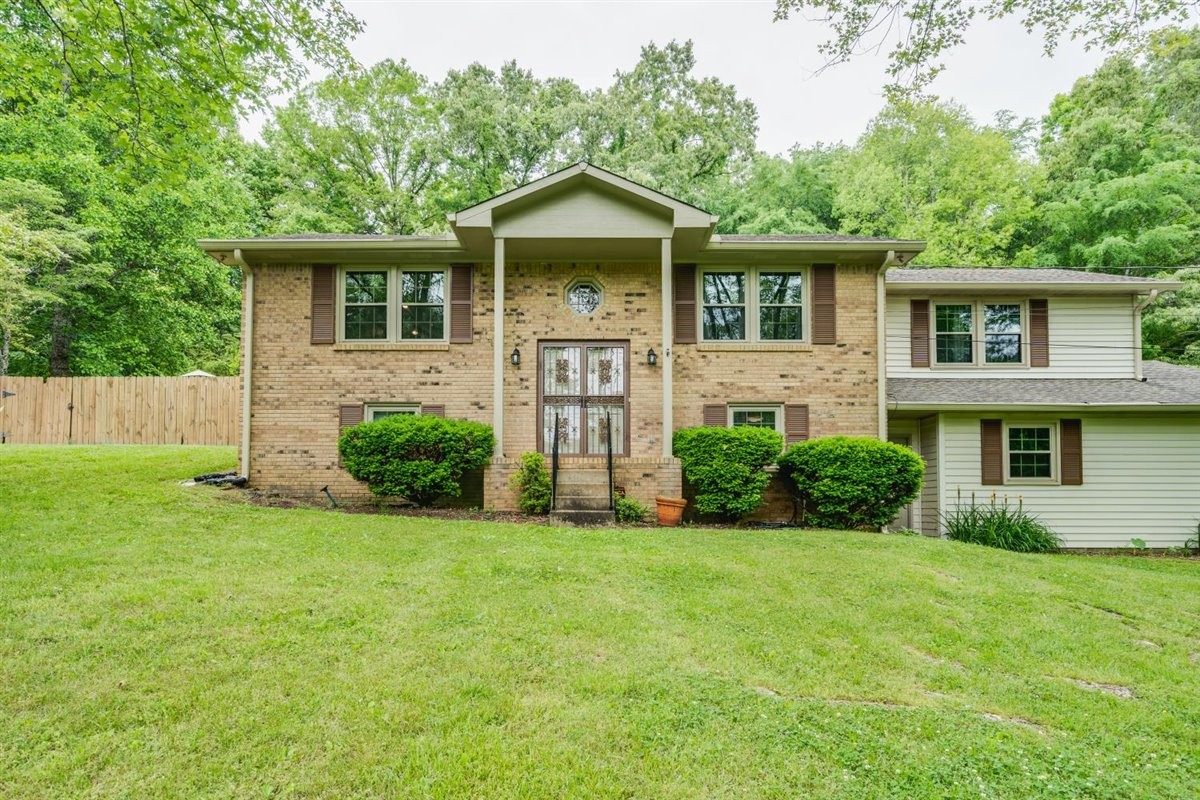 7418 Chester Road Fairview, TN 37062 - Photo 1 of 48 a front view of a house with a yard