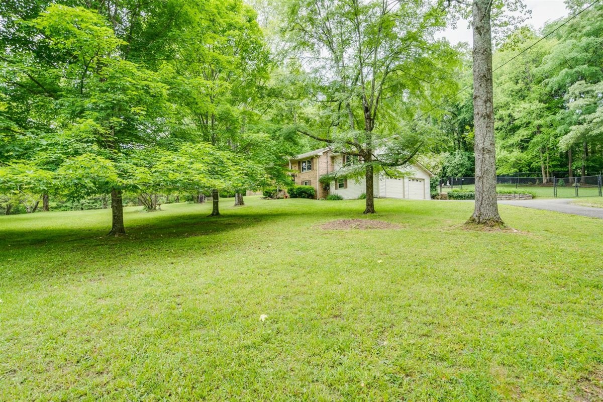 7418 Chester Road Fairview, TN 37062 - Photo 4 of 48 a view of building with trees