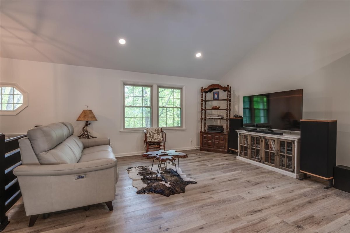 7418 Chester Road Fairview, TN 37062 - Photo 7 of 48 a living room with furniture and a flat screen tv