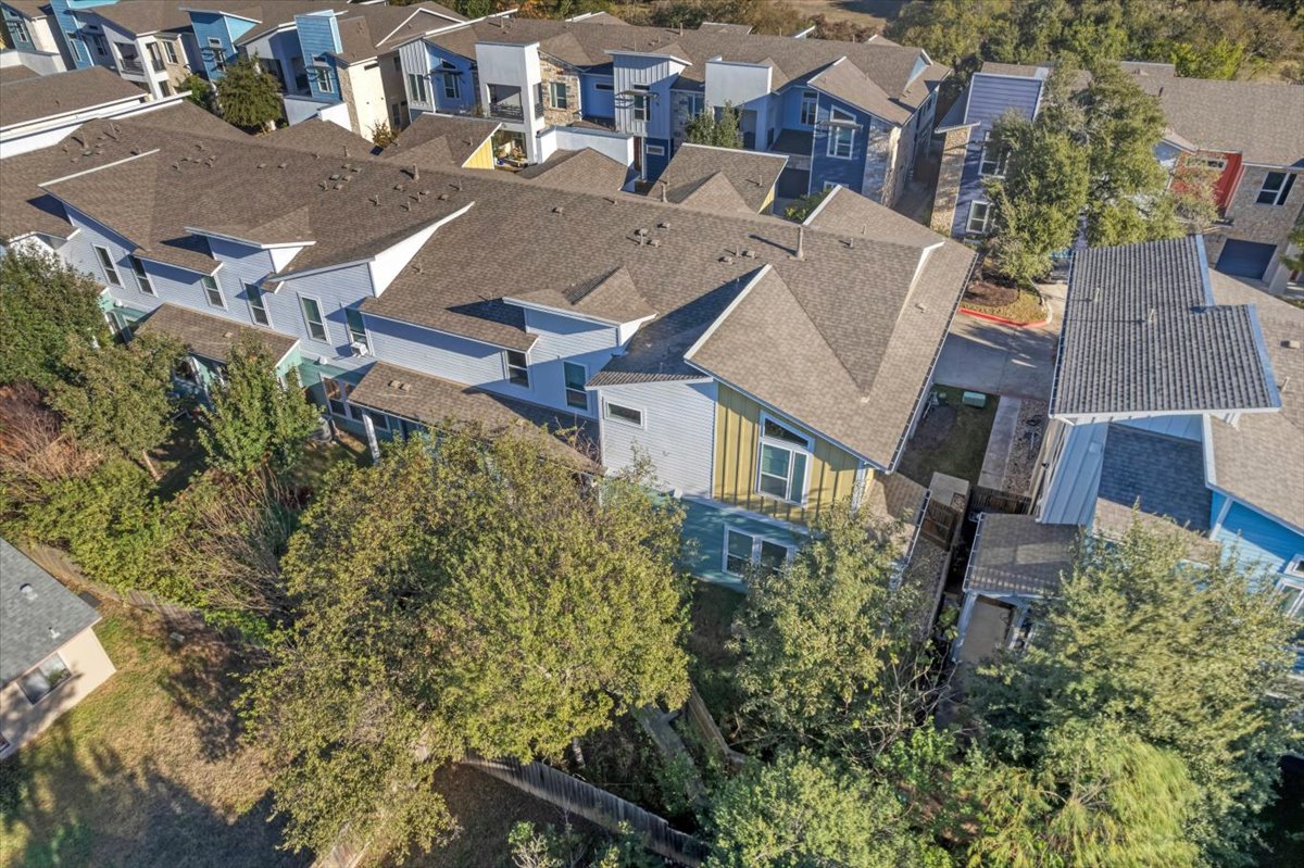 8922 Manchaca Road, Unit 906 Austin, TX 78748 - Photo 24 of 29 an aerial view of residential houses with outdoor space and trees