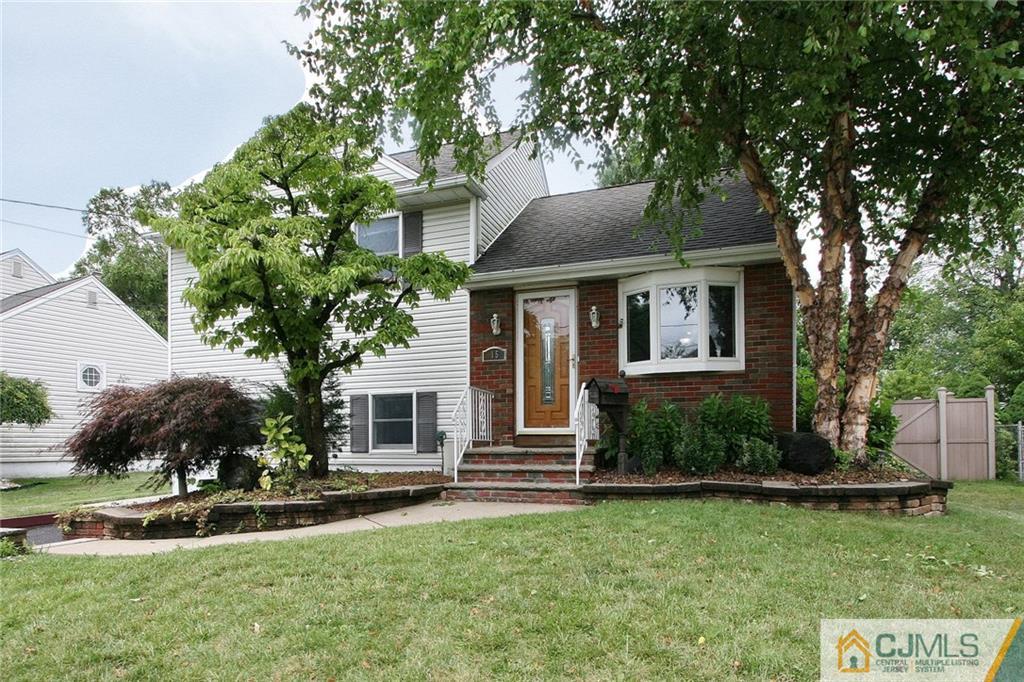 15 Leland Road Edison, NJ 08817 - Photo 2 of 25 a front view of a house with a yard