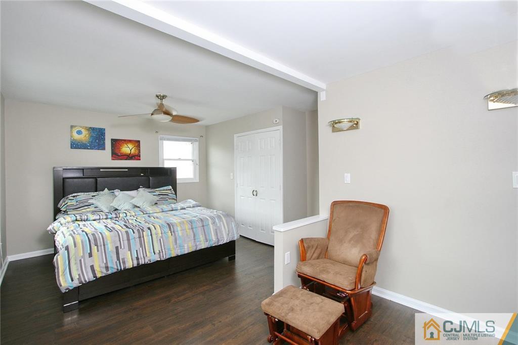 15 Leland Road Edison, NJ 08817 - Photo 18 of 25 a bedroom with a bed chair and dresser
