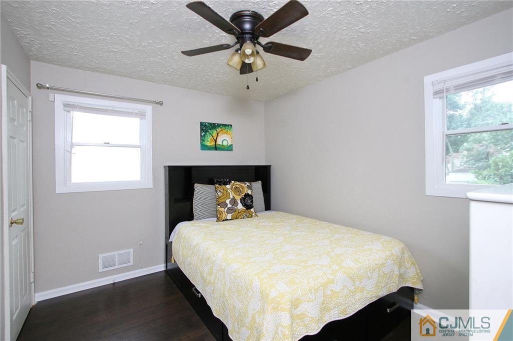 15 Leland Road Edison, NJ 08817 - Photo 20 of 25 a bedroom with a bed and a window