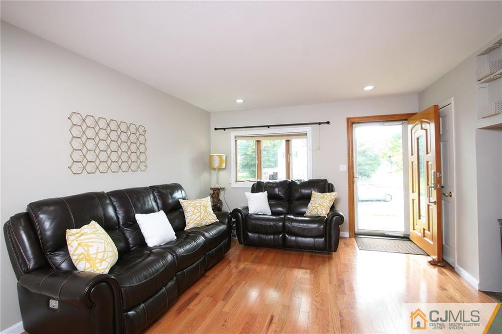 15 Leland Road Edison, NJ 08817 - Photo 3 of 25 a living room with furniture and a large window
