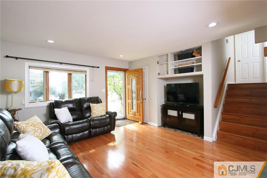 15 Leland Road Edison, NJ 08817 - Photo 4 of 25 a living room with furniture and a fireplace