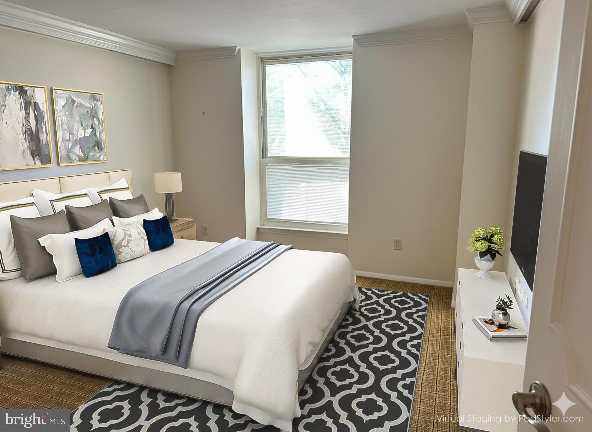41 Conshohocken State Road, Unit 109 Bala Cynwyd, PA 19004 - Photo 12 of 23 a bedroom with a bed and a window