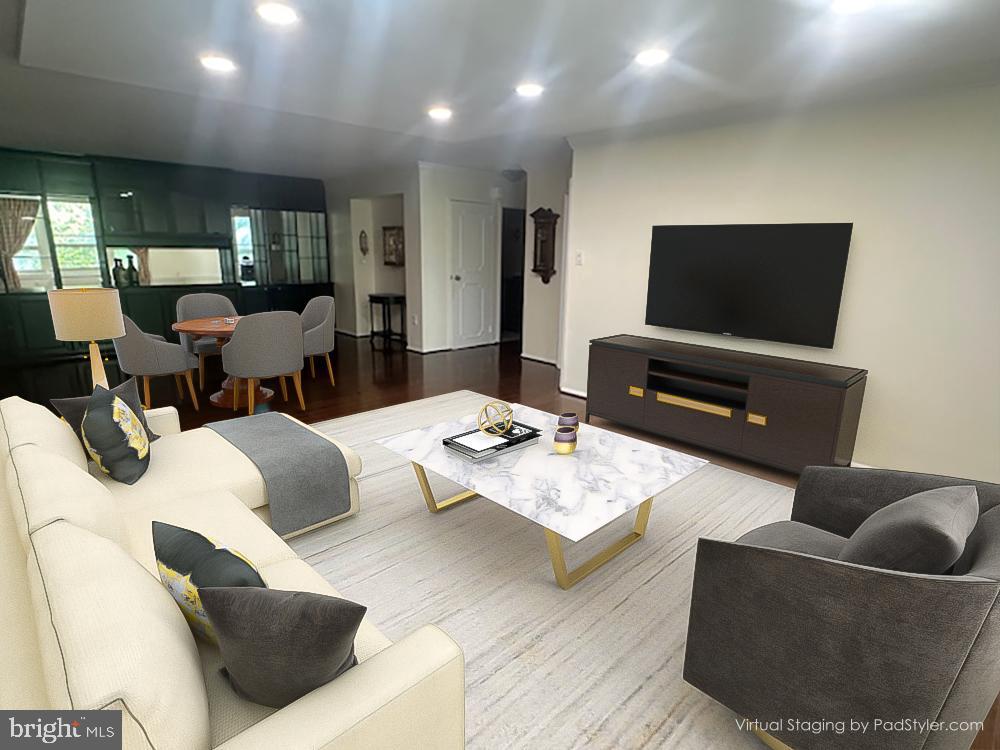 41 Conshohocken State Road, Unit 109 Bala Cynwyd, PA 19004 - Photo 4 of 23 a living room with furniture and a flat screen tv
