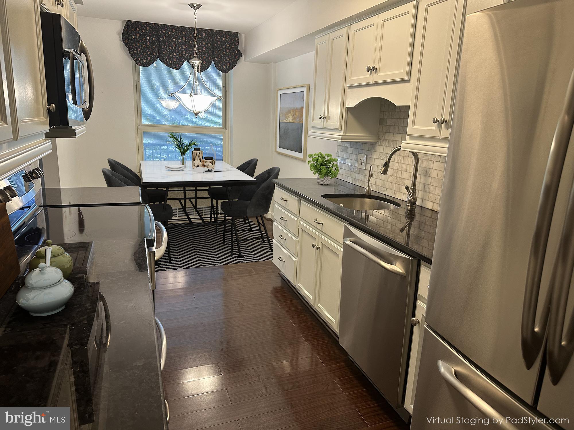 41 Conshohocken State Road, Unit 109 Bala Cynwyd, PA 19004 - Photo 6 of 23 a kitchen with sink cabinets and stove top oven