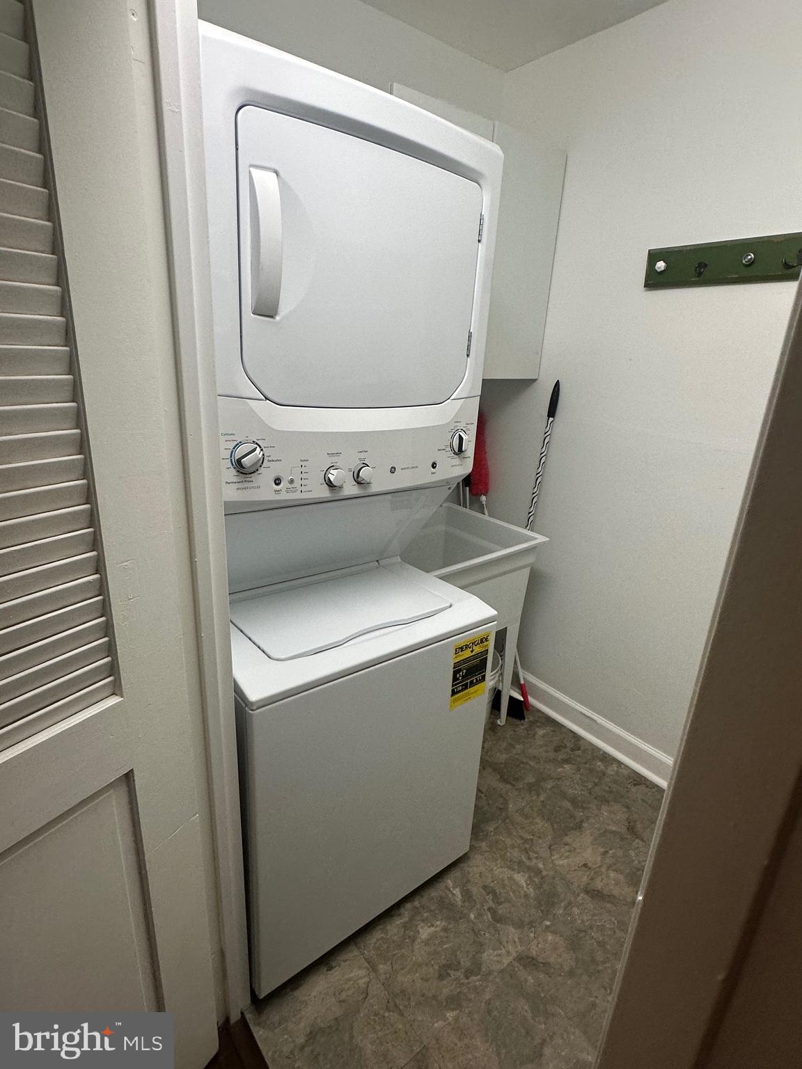 41 Conshohocken State Road, Unit 109 Bala Cynwyd, PA 19004 - Photo 8 of 23 a utility room with dryer and washer